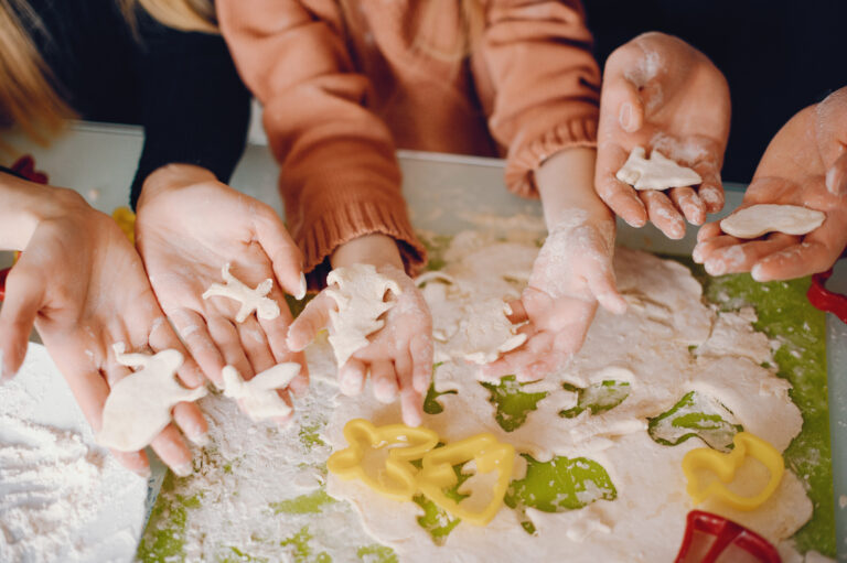 Family cook the dough for cookies